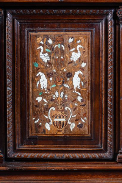 Two-part cabinet in molded and carved walnut,...