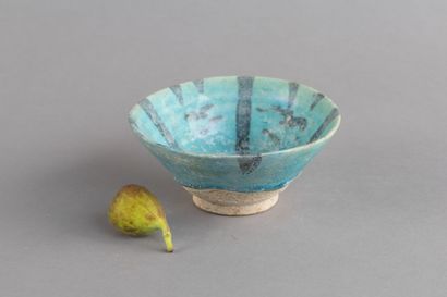 Ceramic bowl with a black radiating pattern...