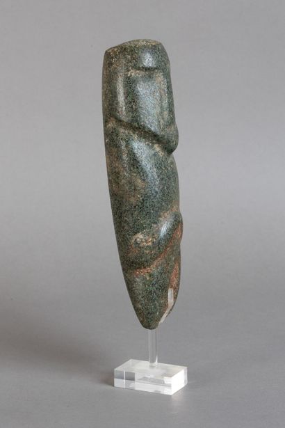 Anthropomorphic idol depicting a figure with...