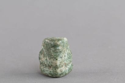Pendant mask. The face is rectangular in...