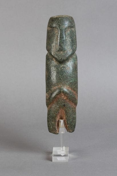 Anthropomorphic idol depicting a figure with...