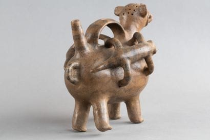 A whistling vase depicting a feline, whose...