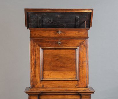 Walnut cabinet with secret compartments;...