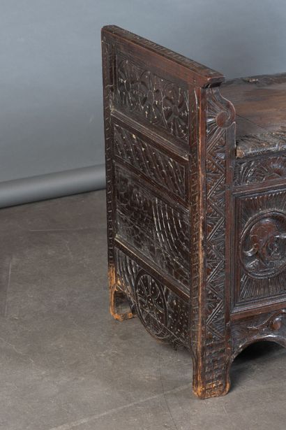 Oak storage bench with a five-panel carved...