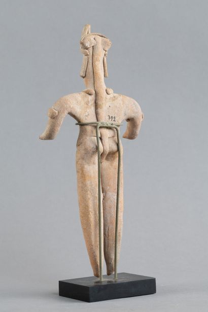 Statuette depicted in a standing position....