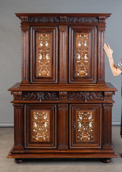 Two-part cabinet in molded and carved walnut,...