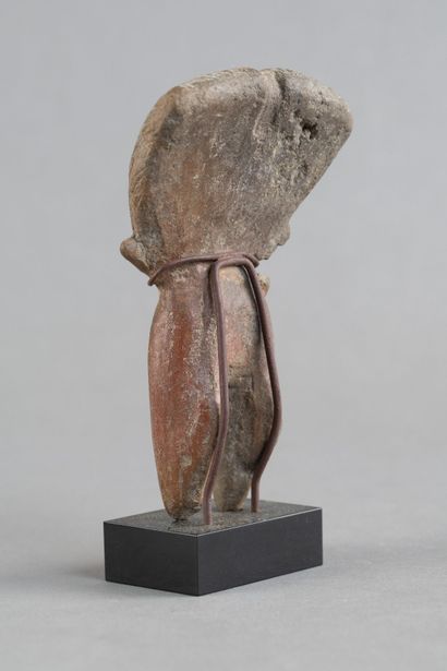 Female statuette. The hairstyle is notable,...