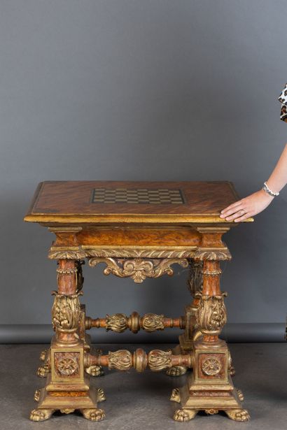 Lacquered and gilded wooden game table.
In...