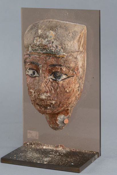 Anthropomorphic mask from a sarcophagus lid....