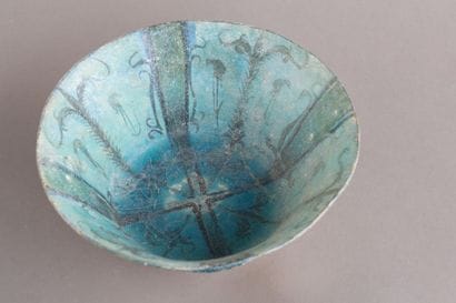 A beautiful ceramic bowl with black decoration...