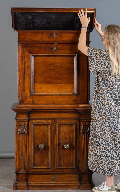 Walnut cabinet with secret compartments;...
