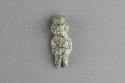 Anthropomorphic idol depicting a figure with...