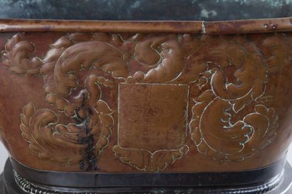 Copper basin with a repoussé coat of arms...