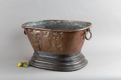 Copper basin with a repoussé coat of arms...