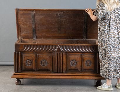 Walnut chest with a front panel featuring...