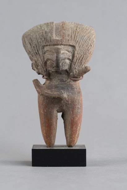 Female statuette. The hairstyle is notable,...
