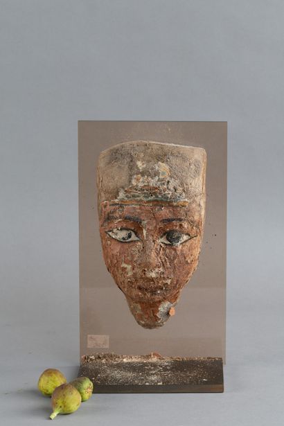 Anthropomorphic mask from a sarcophagus lid....