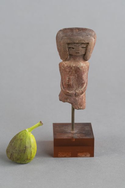 Bust of a female figurine. Terracotta with...