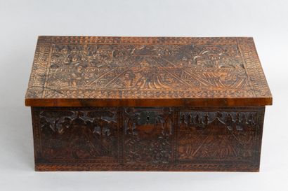 Cedar chest with a top-opening lid, featuring...