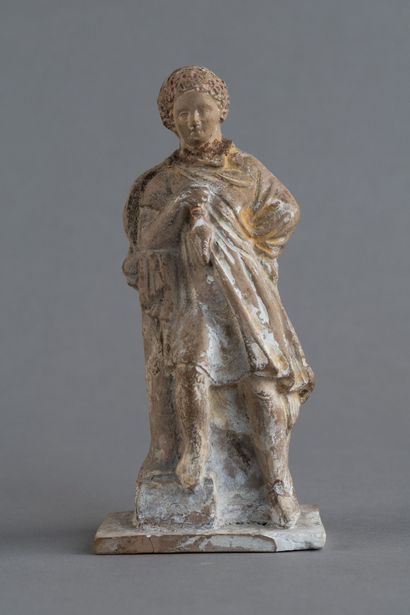 Statuette jeune homme debout tenant une bourse....