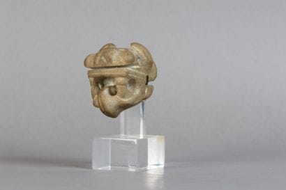 Zoomorphic weapon-shaped object depicting...