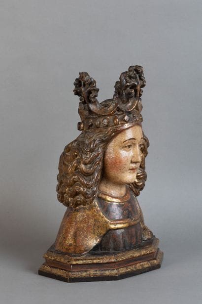 Carved, polychrome, and gilded wooden bust...
