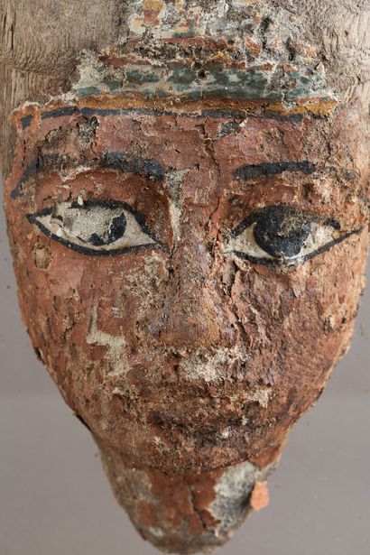 Anthropomorphic mask from a sarcophagus lid....