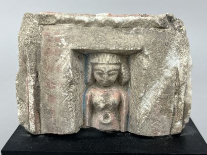 Upper part of a votive statuette depicting...