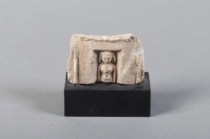Upper part of a votive statuette depicting...