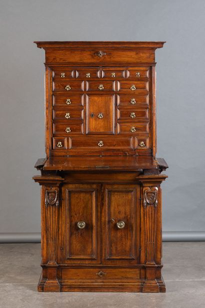 Walnut cabinet with secret compartments;...