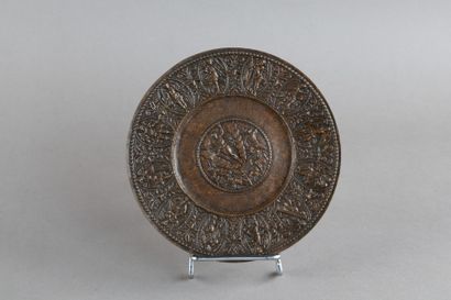 Bronze paten with a natural patina. Central...