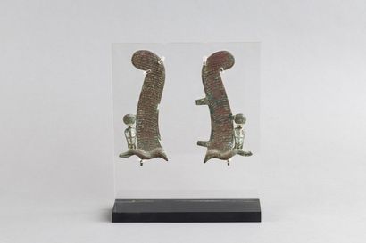 Pair of feathers flanked by cobras. Bronze....