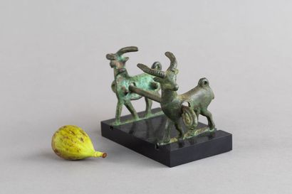 Horse bit decorated with two goats. Bronze....