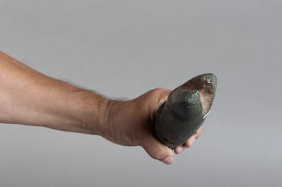 Anthropomorphic idol depicting a figure with...