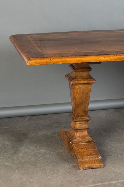 Walnut table with burl inlay; the tabletop...