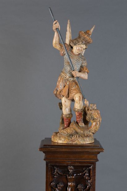 Carved, polychrome, and gilded wooden statue...