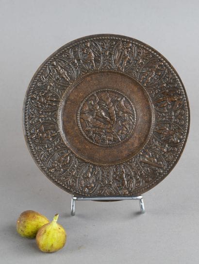 Bronze paten with a natural patina. Central...