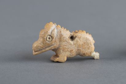 Pendant amulet depicting a stylized wild...