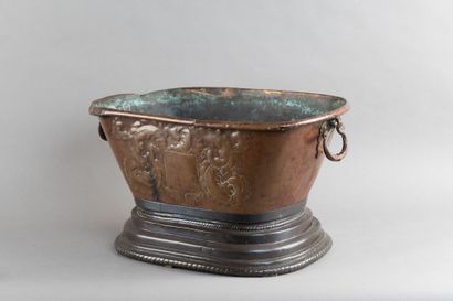 Copper basin with a repoussé coat of arms...