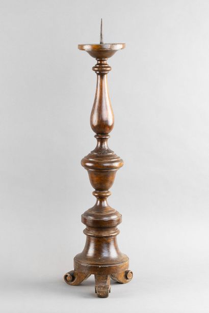 Carved, turned wooden candleholder with a...
