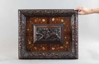 Carved walnut panel depicting a woman riding...
