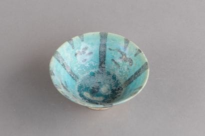 Ceramic bowl with a black radiating pattern...