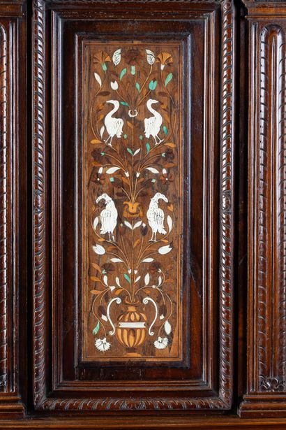 Two-part cabinet in molded and carved walnut,...