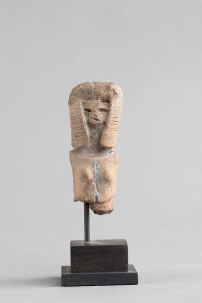 Bust of a female statuette. Terracotta with...