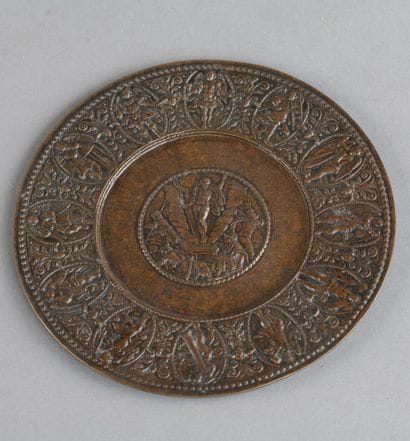 Bronze paten with a natural patina. Central...