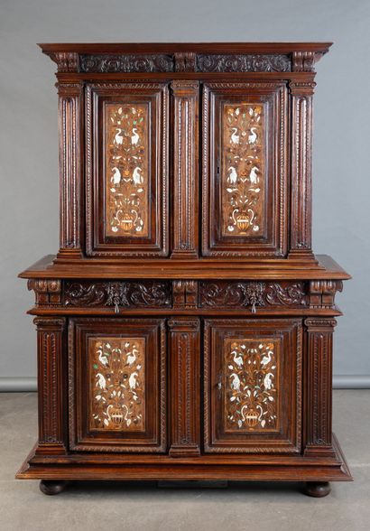 Two-part cabinet in molded and carved walnut,...