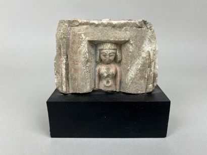 Upper part of a votive statuette depicting...