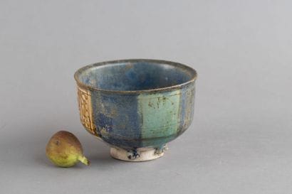 Tall ceramic cup with metallic lustre decoration...