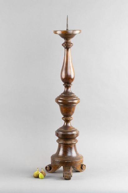 Carved, turned wooden candleholder with a...