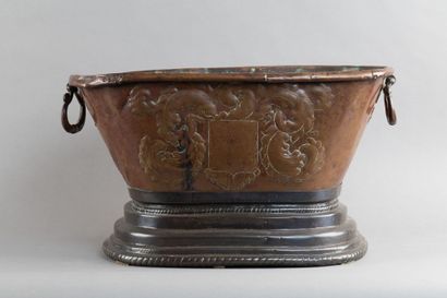 Copper basin with a repoussé coat of arms...